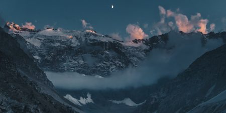 The moon and sunset clouds at Kulikalon wall, Fann mountains, Tajikistan