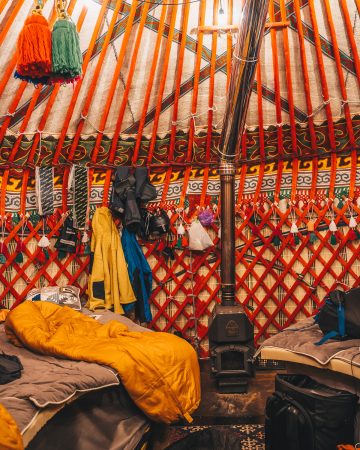 Inside a yurt - wood burning stove is visible